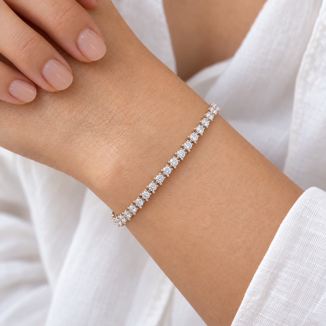 Three-Prong Round Lab Diamond Tennis Bracelet worn on the wrist, shown true to size