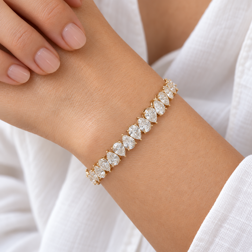 Interlocking Pear Lab Diamond Tennis Bracelet worn on the wrist, shown true to size