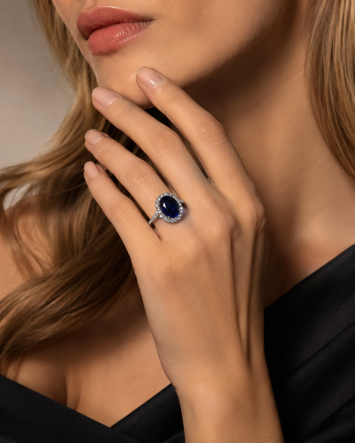 The Twisted Diana — Diamond Halo/Twist Band Oval Blue Sapphire Ring