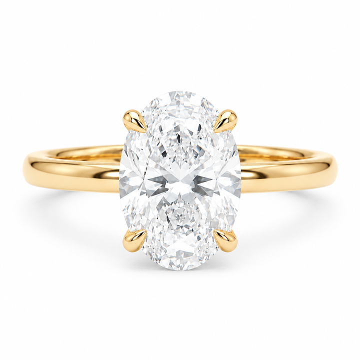 Oval lab diamond engagement ring in 14K yellow gold, front view on white