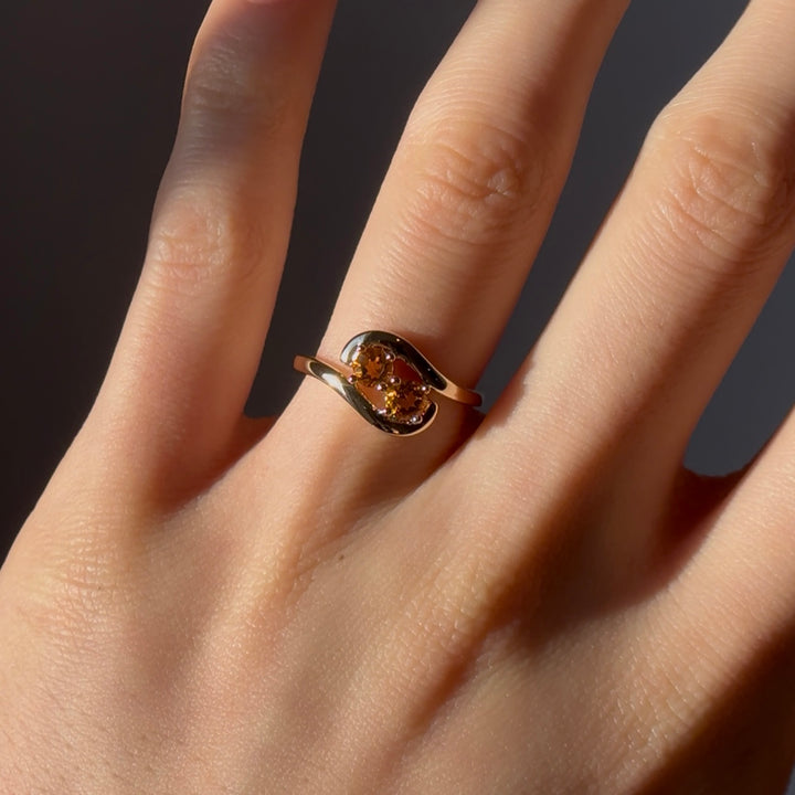 0.70ct "Stretch & Sword" Orange Sapphire Two-Stone Ring in Yellow Gold
