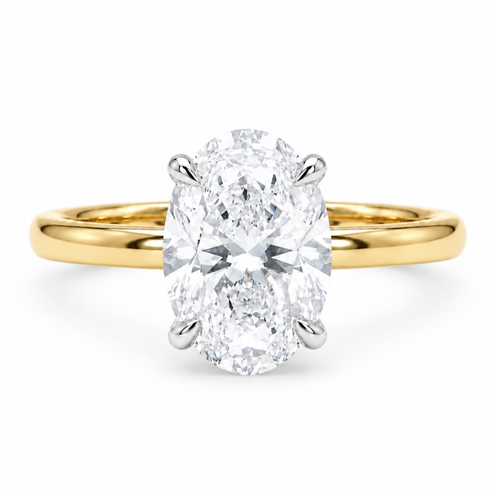 Oval lab diamond engagement ring in two-tone gold, front view on white