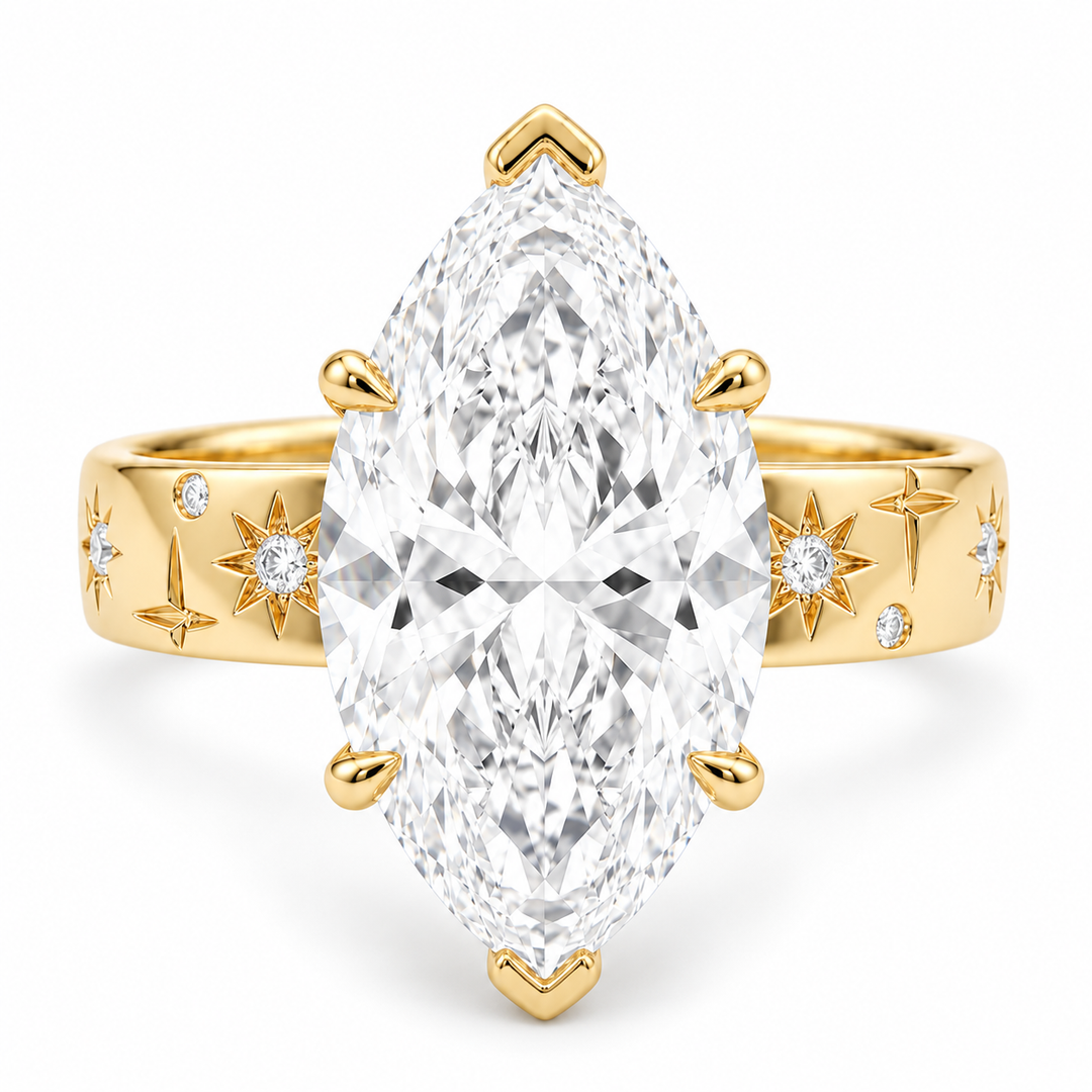 The Starlight marquise lab diamond ring with engraved star band in 14K yellow gold, front view on white