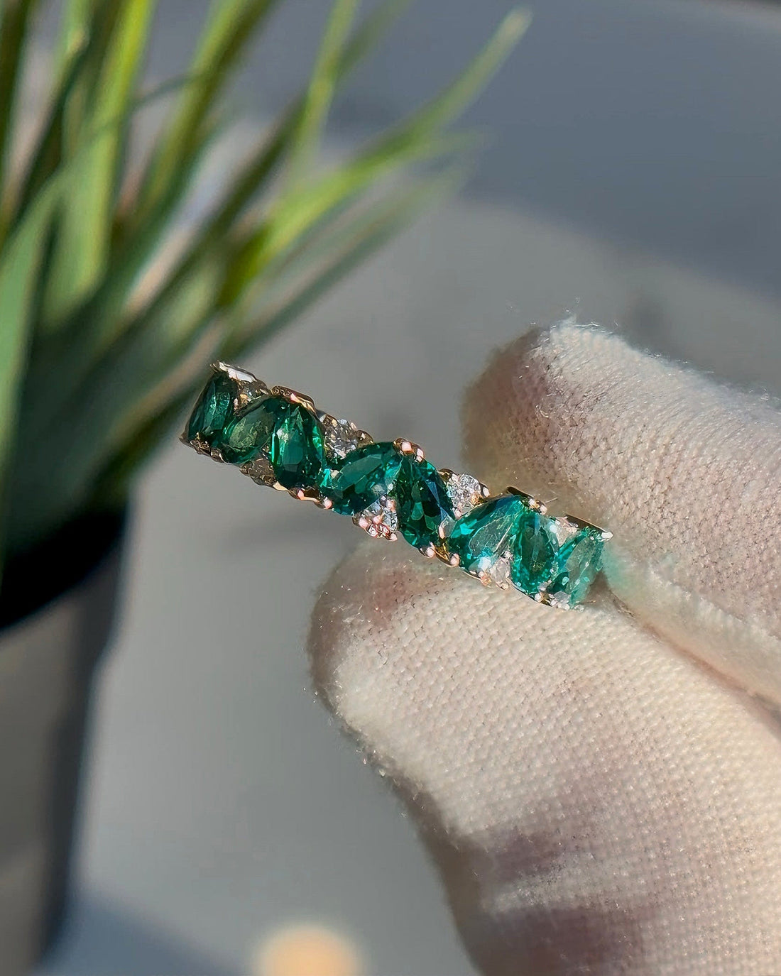 Pear emerald and diamond eternity ring, view 6