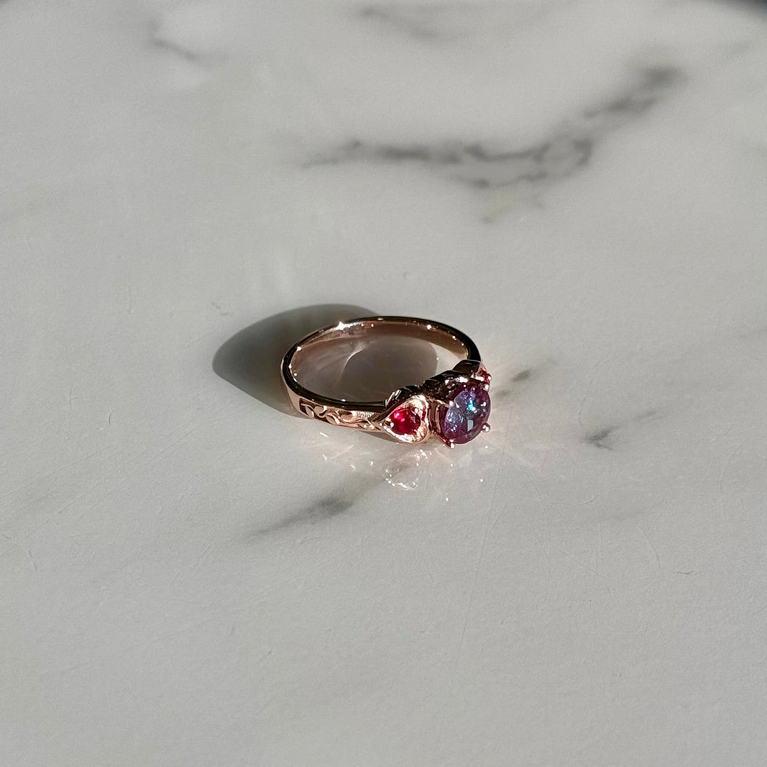 1.00ct "Arcfire Bond" Round Alexandrite & Rubies Three-Stone Ring in 10K Rose Gold