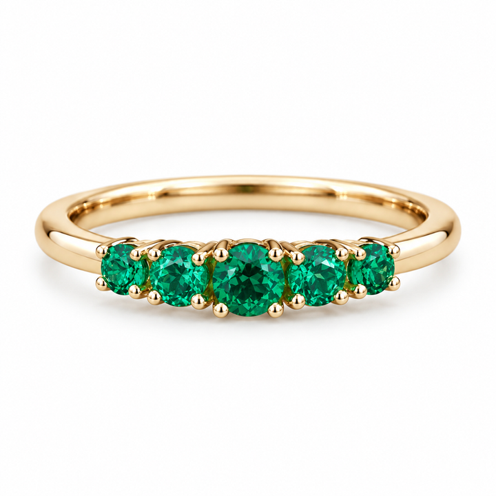 Round lab emerald five-stone ring in 14K yellow gold, front view on white