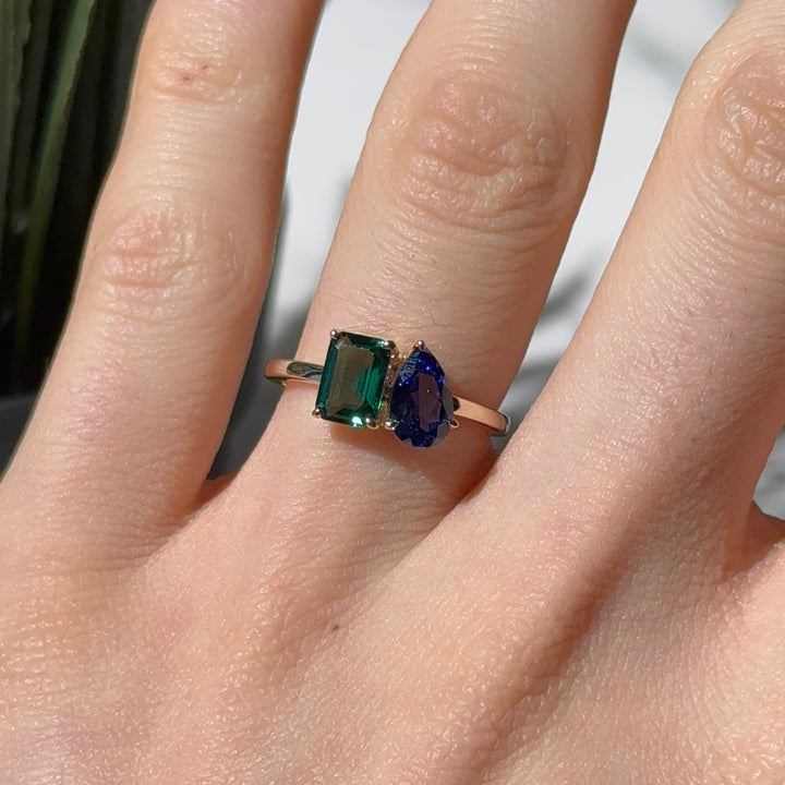 Customized™ 5x8mm, 1.00ct Pear Cut Blue Sapphire and 5x7mm, 1.19ct Emerald Cut Zambian Emerald Toi Et Moi Ring in Yellow Gold