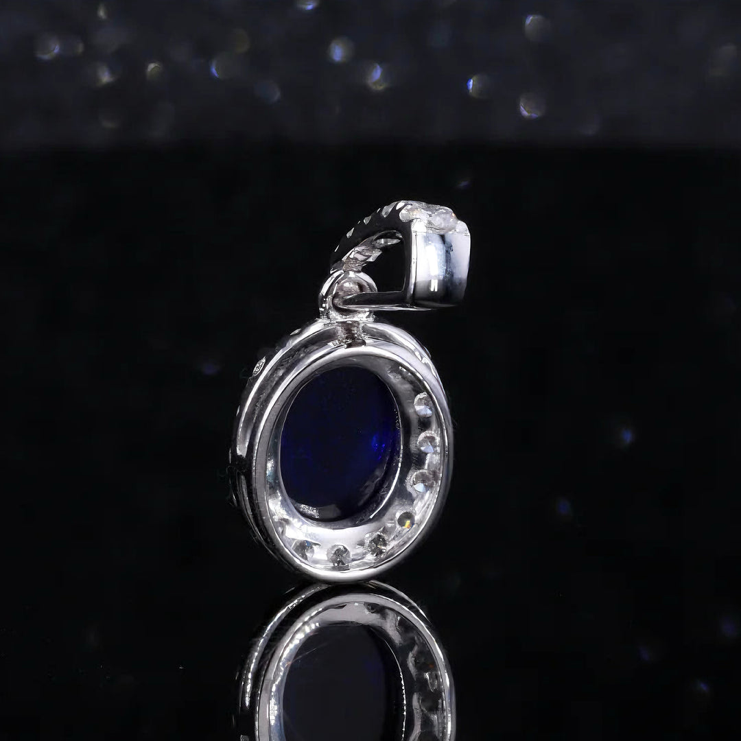 6x8mm, 1.80ct Oval Cabochon Lab-Grown Blue Sapphire with Diamond Halo Pendant in 14K White Gold