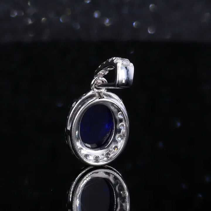 6x8mm, 1.80ct Oval Cabochon Lab-Grown Blue Sapphire with Diamond Halo Pendant in 14K White Gold