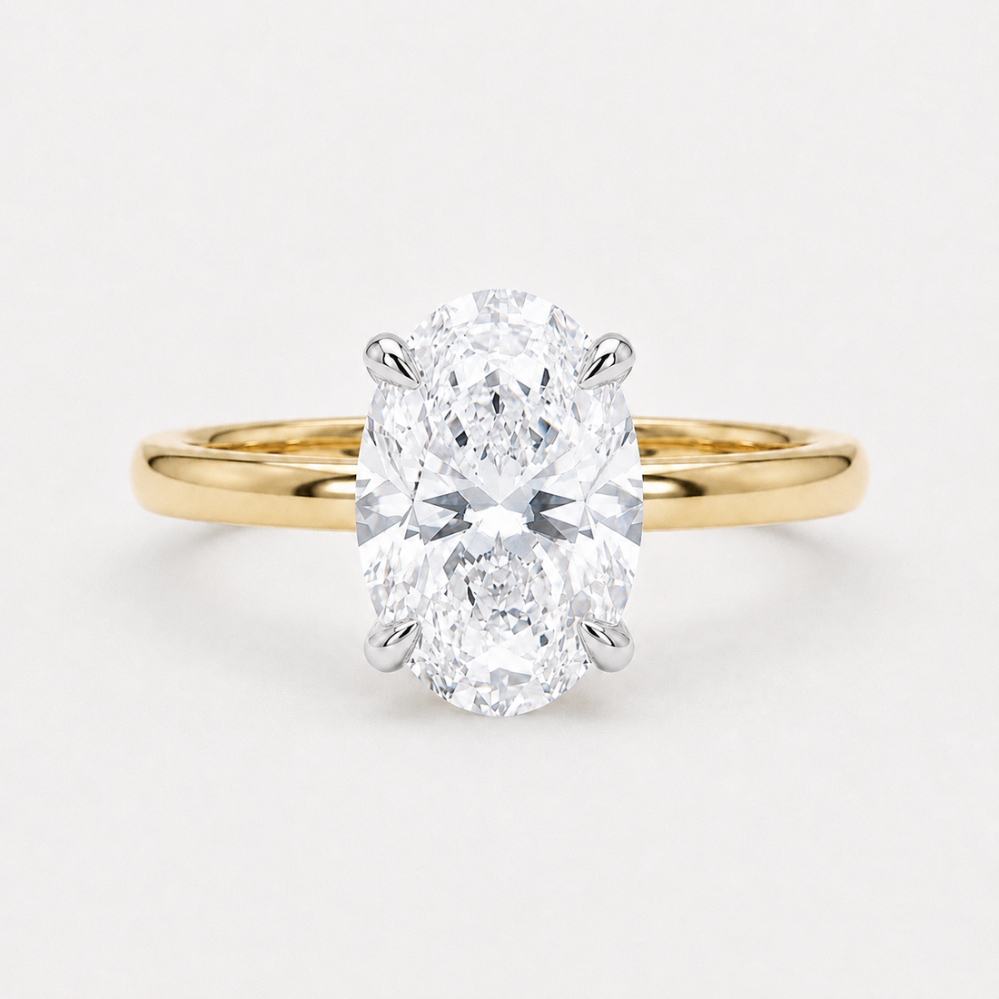 Oval lab diamond engagement ring in two-tone gold