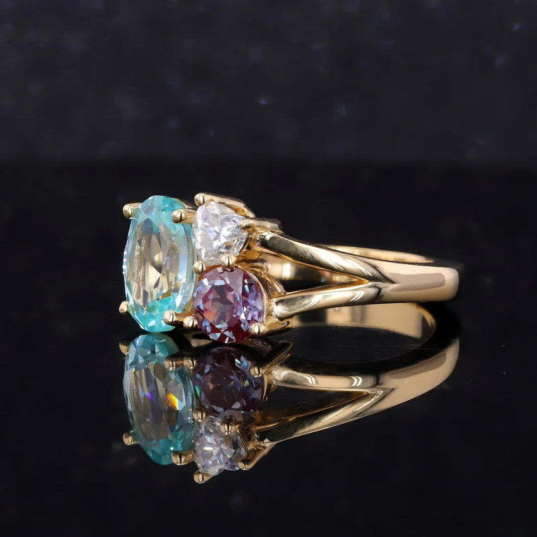 7x9mm Oval Cut Paraiba, 4x4mm Round Cut Alexandrite, 4mm Heart Cut Moissanite Three Stone Toi Et Moi Ring in Solid 18K Yellow Gold