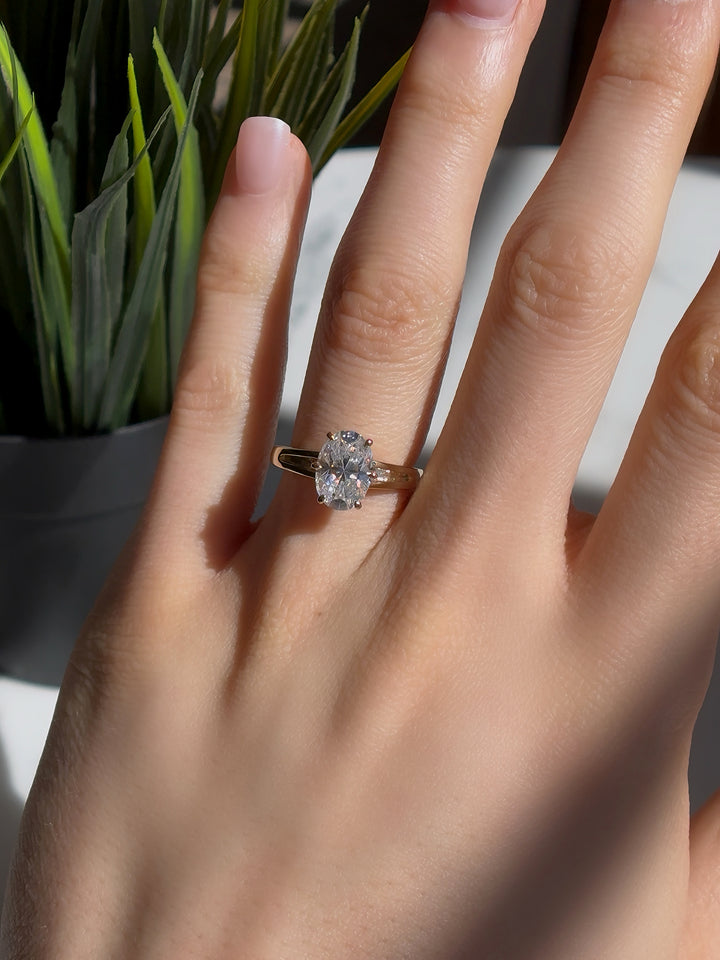 7x10mm Oval Cut Moissanite Ring with Valley Band in Yellow Gold