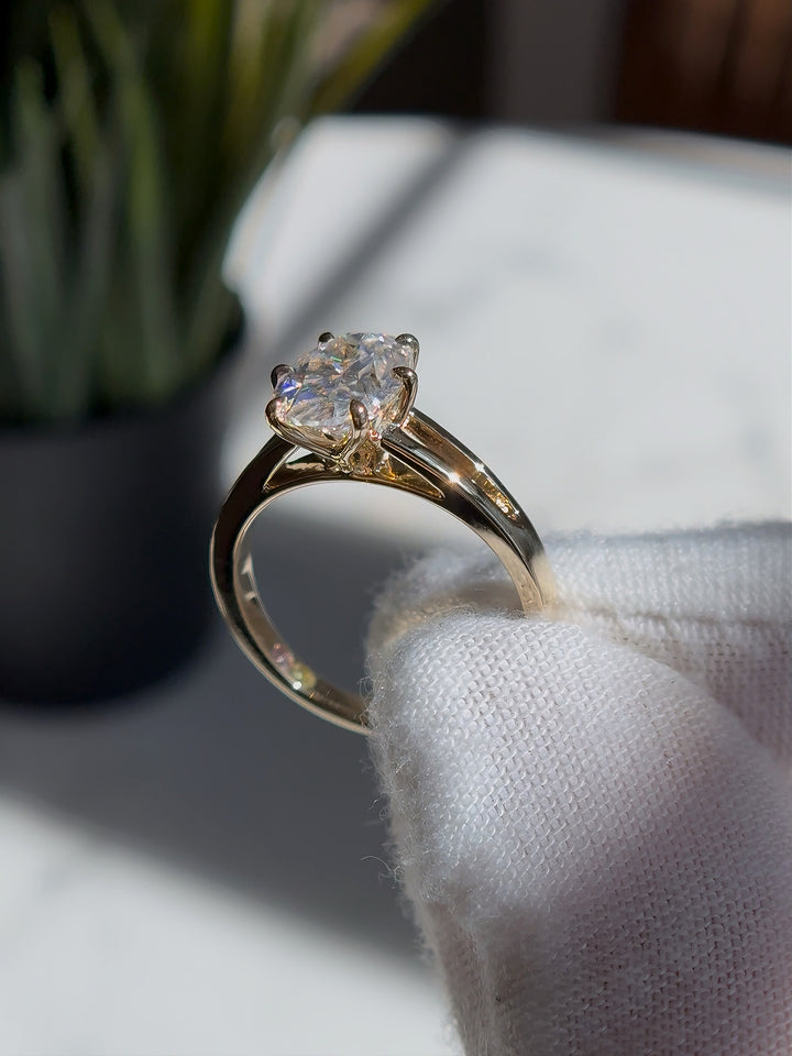 7x10mm Oval Cut Moissanite Ring with Valley Band in Yellow Gold