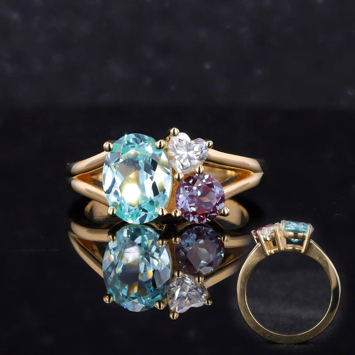 7x9mm Oval Cut Paraiba, 4x4mm Round Cut Alexandrite, 4mm Heart Cut Moissanite Three Stone Toi Et Moi Ring in Solid 18K Yellow Gold