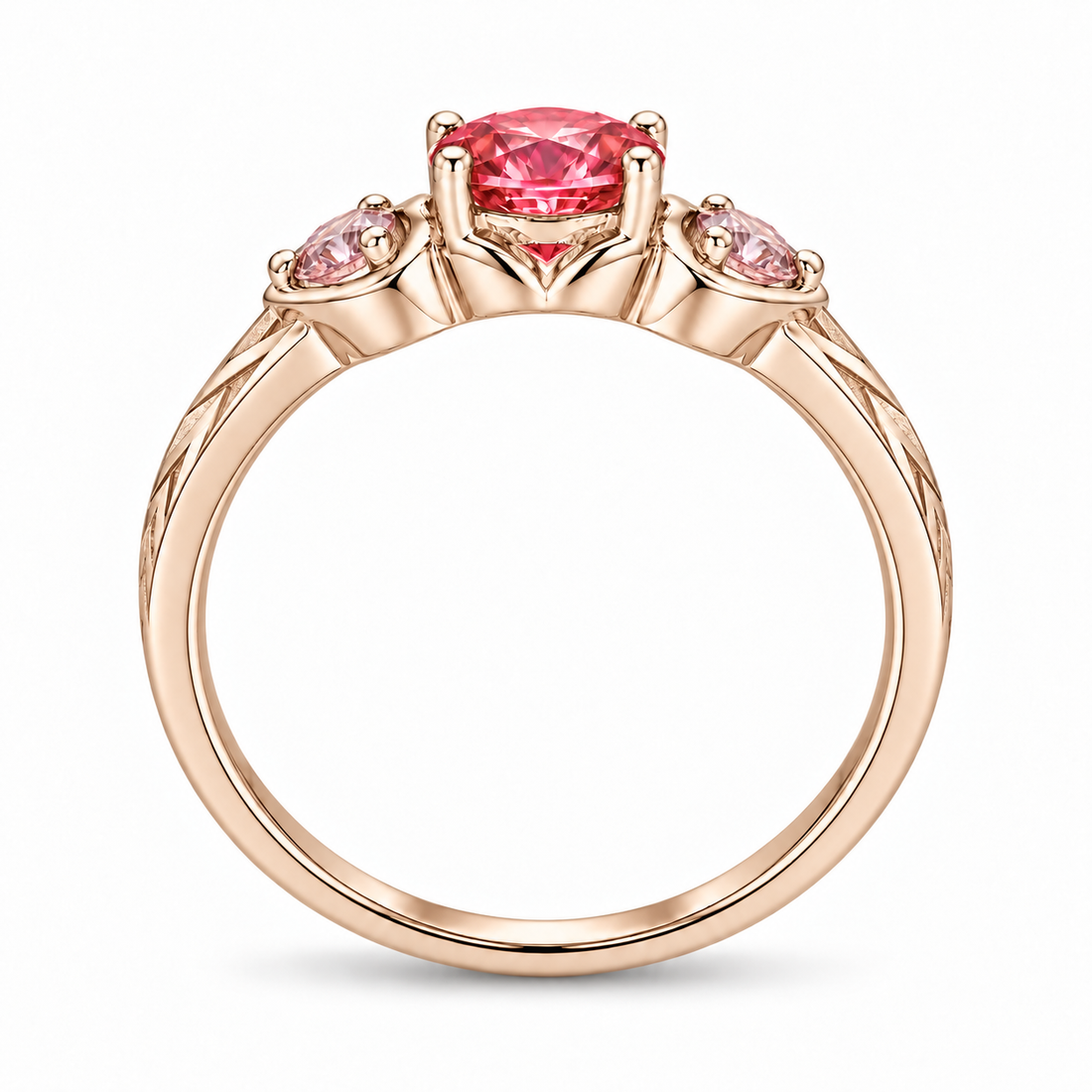 Atoms & Impact pink sapphire three-stone ring in champagne rose gold, profile view on a clean white background