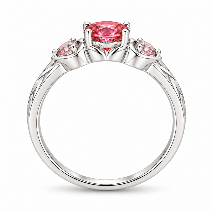 Atoms & Impact pink sapphire three-stone ring in white gold, profile view on a clean white background