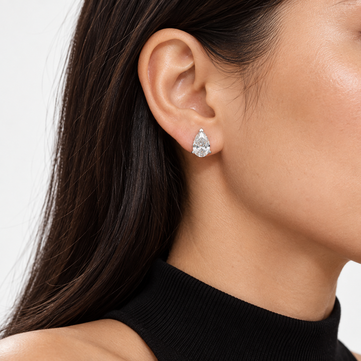 Pear Lab Diamond Solitaire Stud Earrings worn on the ear