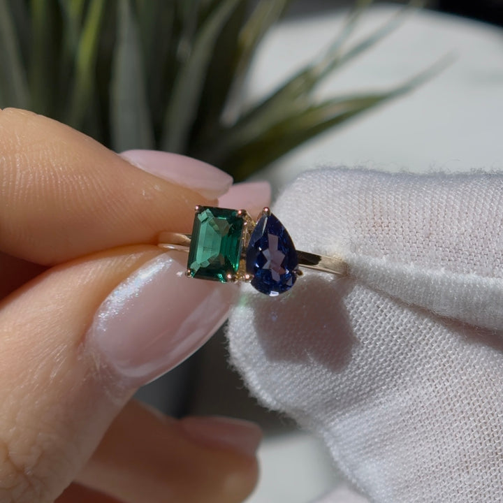 Customized™ 5x8mm, 1.00ct Pear Cut Blue Sapphire and 5x7mm, 1.19ct Emerald Cut Zambian Emerald Toi Et Moi Ring in Yellow Gold