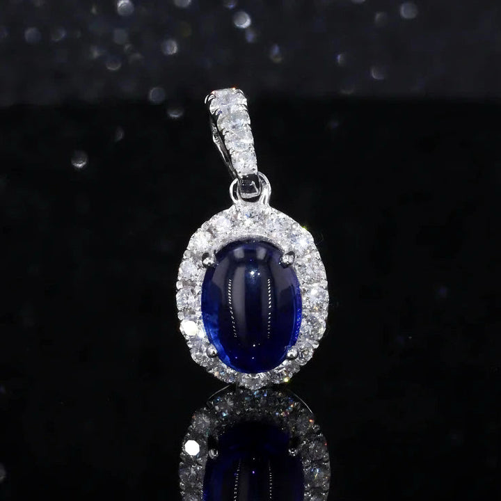 6x8mm, 1.80ct Oval Cabochon Lab-Grown Blue Sapphire with Diamond Halo Pendant in 14K White Gold