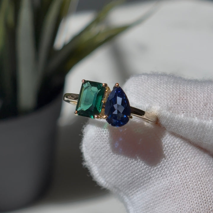 Customized™ 5x8mm, 1.00ct Pear Cut Blue Sapphire and 5x7mm, 1.19ct Emerald Cut Zambian Emerald Toi Et Moi Ring in Yellow Gold