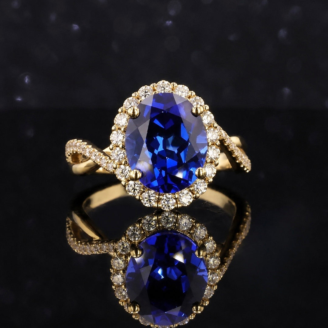 The Twisted Diana — Diamond Halo/Twist Band Oval Blue Sapphire Ring
