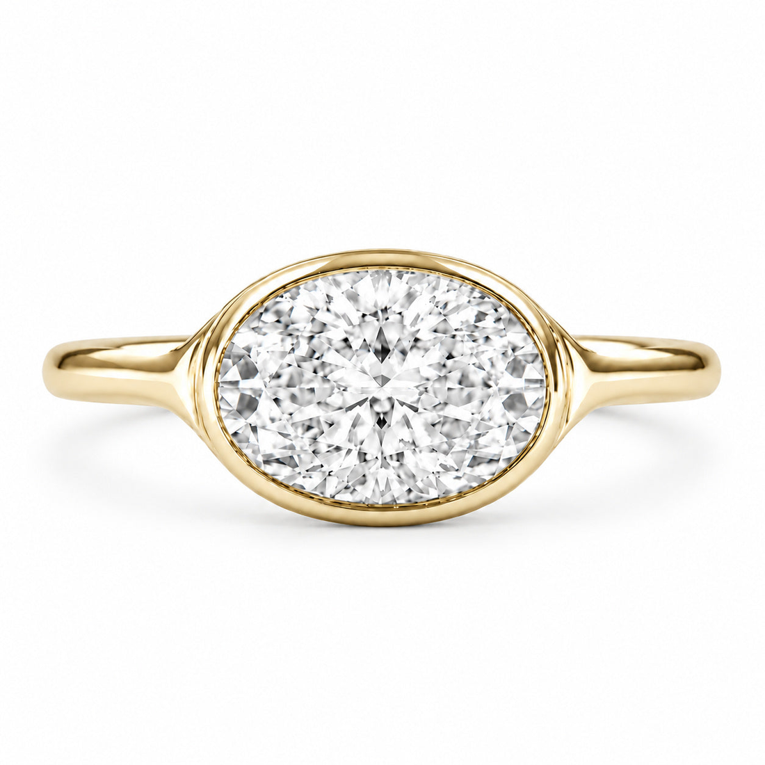 The Horizon east-west oval lab diamond bezel ring in 14K yellow gold