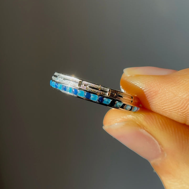 4mm "Stretch & Sword" Sapphire/Paraiba Band Ring in White Gold