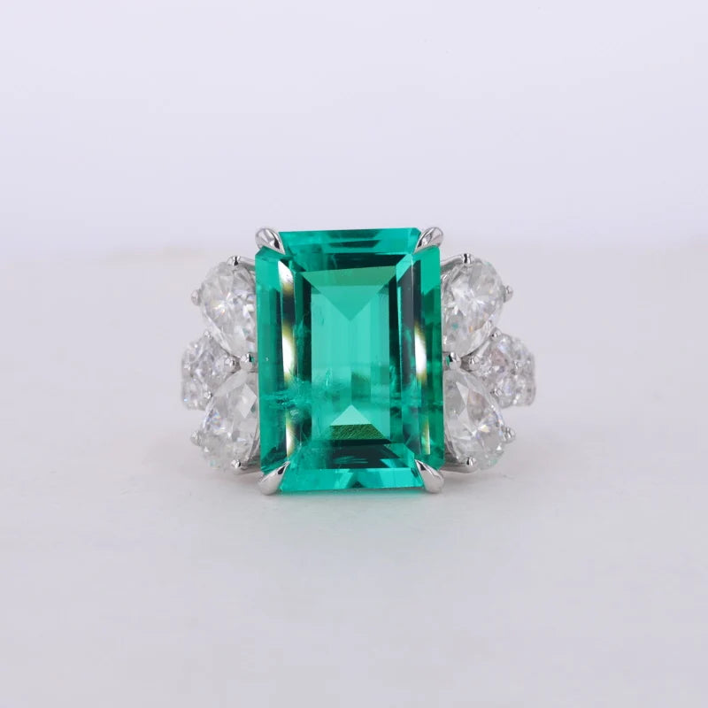 10*14mm Emerald Cut Colombian Green Emerald and Pear Cut Moissanite Ring in 14K White Gold