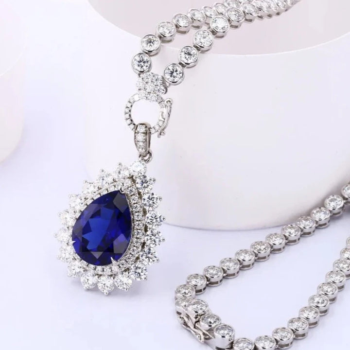 12x16mm, 9.00ct Pear Lab-Grown Blue Sapphire Pendant with Bezel-Set Moissanite Tennis Necklace with 10K White Gold
