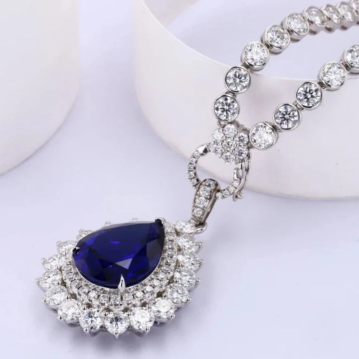 12x16mm, 9.00ct Pear Lab-Grown Blue Sapphire Pendant with Bezel-Set Moissanite Tennis Necklace with 10K White Gold