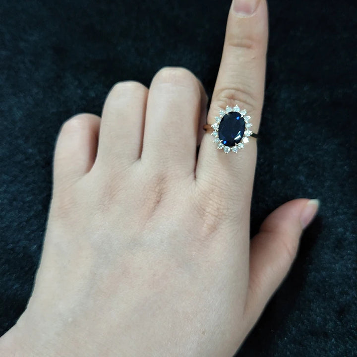 8x11mm, 5.27ct Oval Lab-Grown Blue Sapphire "Diana Setting" Ring with Diamond Halo in 14K Yellow Gold