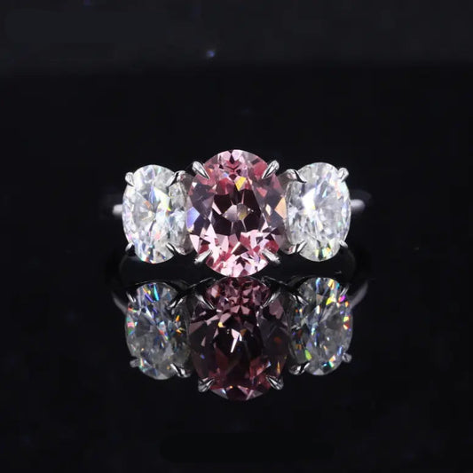 7x9mm Oval Cut Sakura Pink Sapphire with Diamonds Three-Stone Ring in 14K White Gold