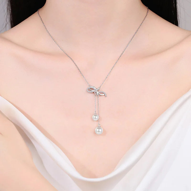 6mm, 8mm Pearls and Moissanite Dangle Ribbon Pendant Necklace in Platinum Plated 925 Silver