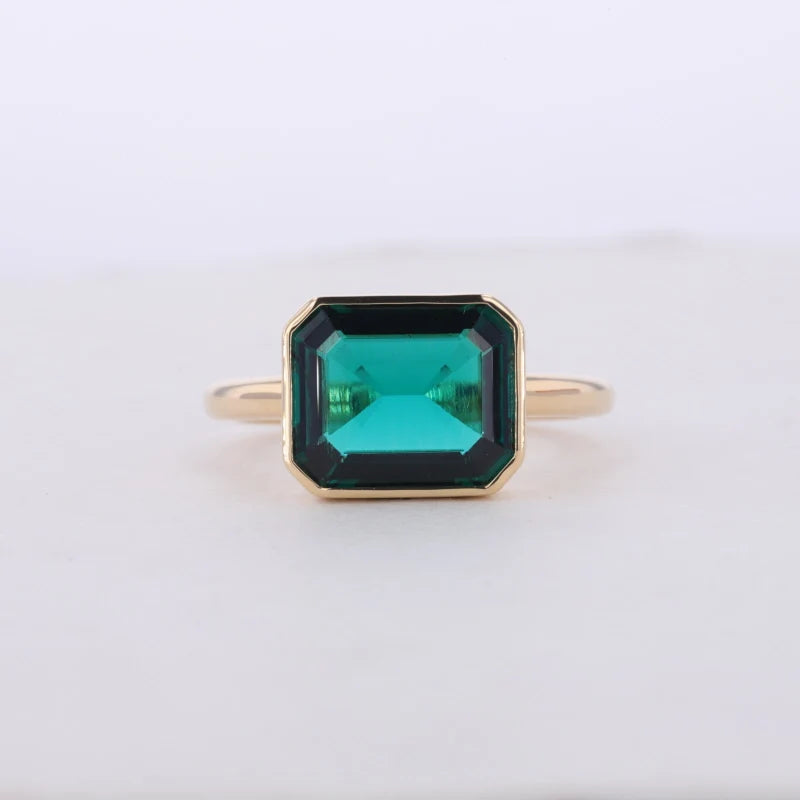 9*11mm Emerald Cut Emerald East to West Solitaire Bezel Set Ring in 14K Solid Yellow Gold
