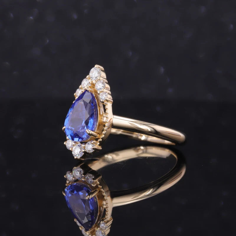 6*9mm Pear Cut Blue Sapphire with Moissanite Halo in 10K Yellow Gold