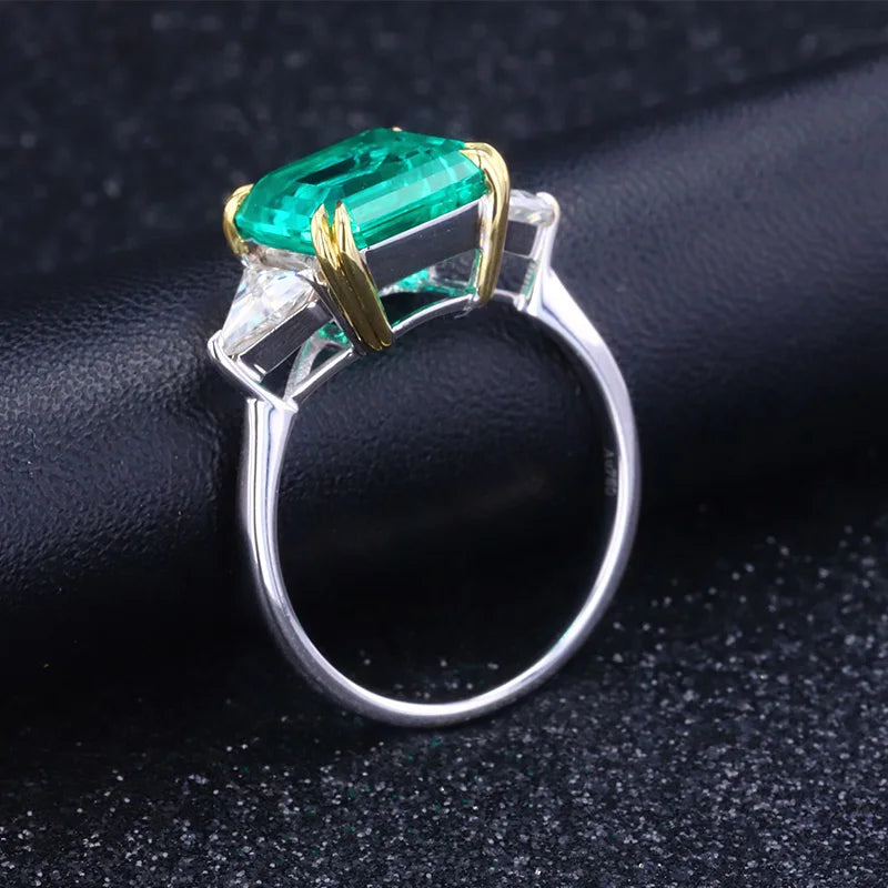 The Facet — Emerald Three-Stone Ring