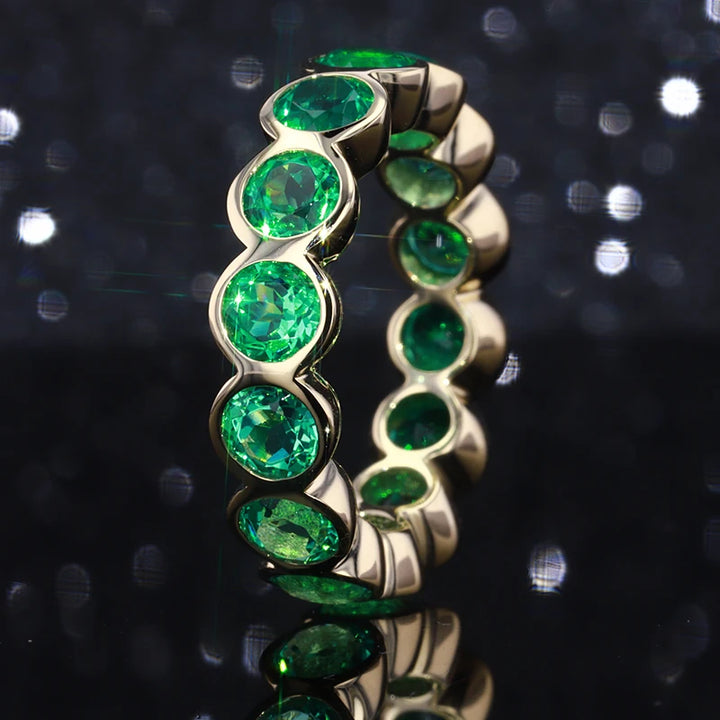 3mm, 1.50ctw Round Lab-Grown Colombian Emerald Bezel-Set Eternity Band Ring in 14K Yellow Gold