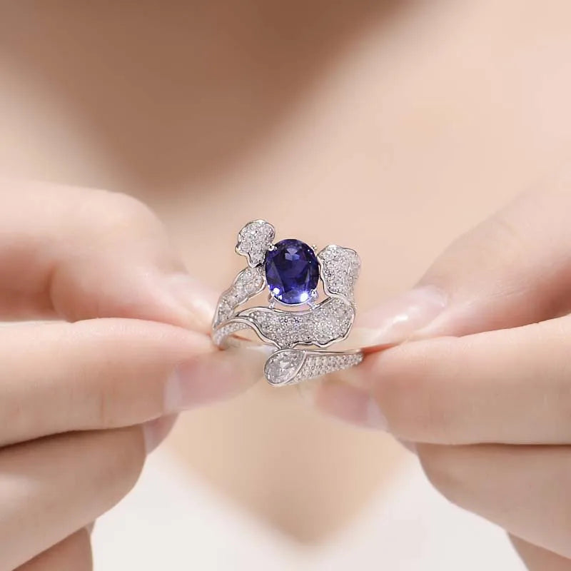 Oval Cut Blue Sapphire with Crushed Halo Ring in Platinum-Plated 925 Sterling Silver