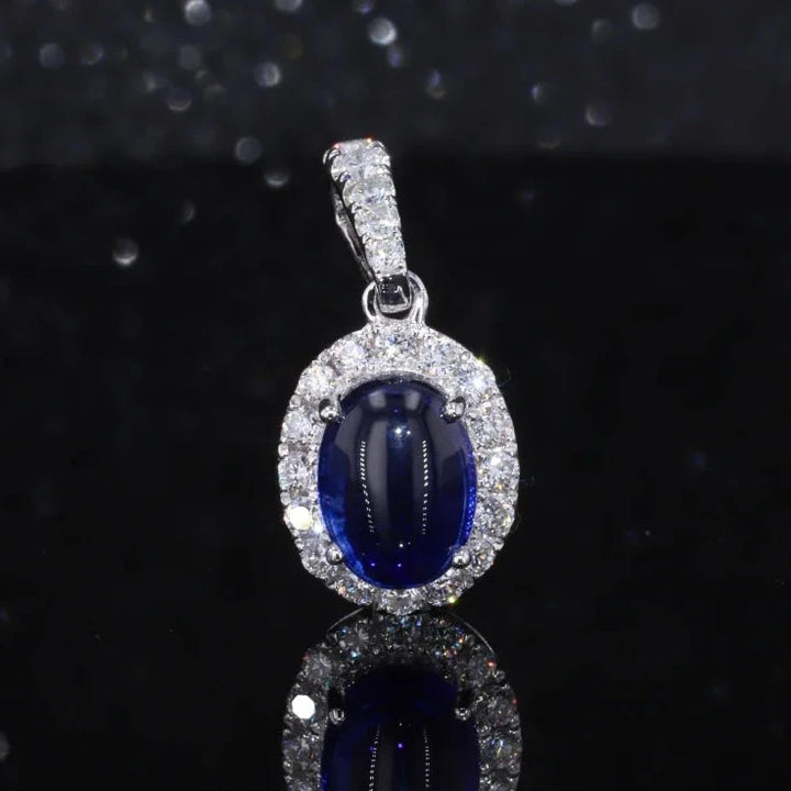6x8mm, 1.80ct Oval Cabochon Lab-Grown Blue Sapphire with Diamond Halo Pendant in 14K White Gold