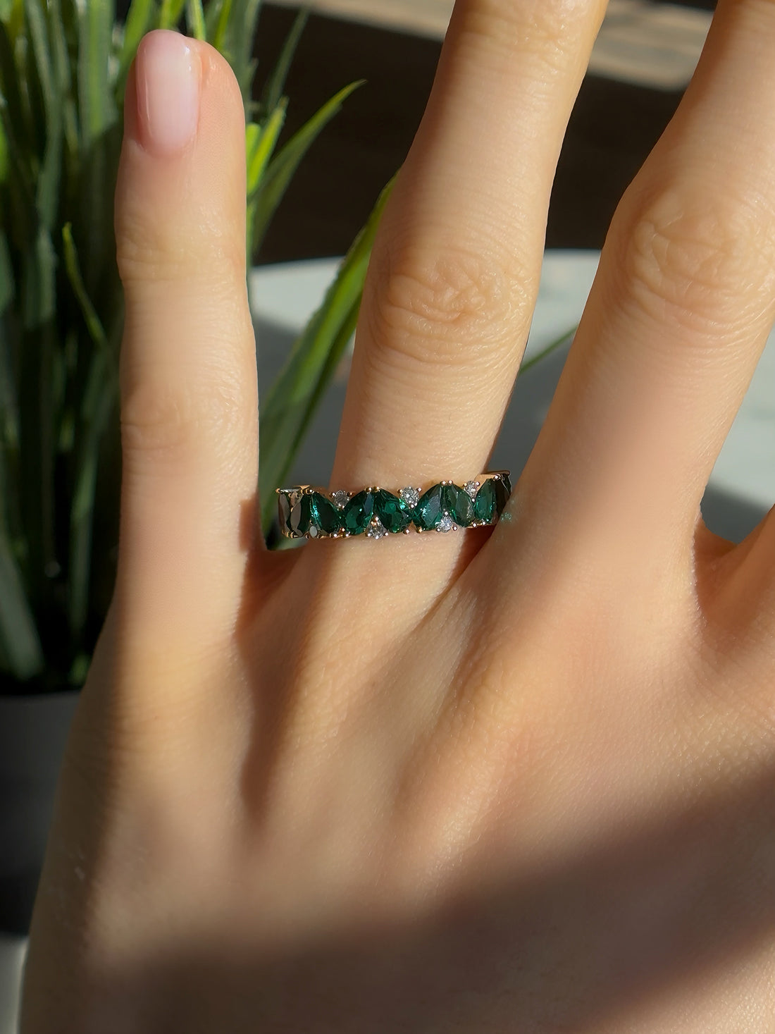 Pear emerald and diamond eternity ring, view 7
