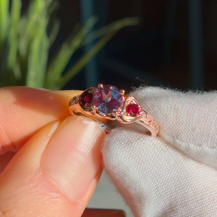1.00ct "Arcfire Bond" Round Alexandrite & Rubies Three-Stone Ring in 10K Rose Gold