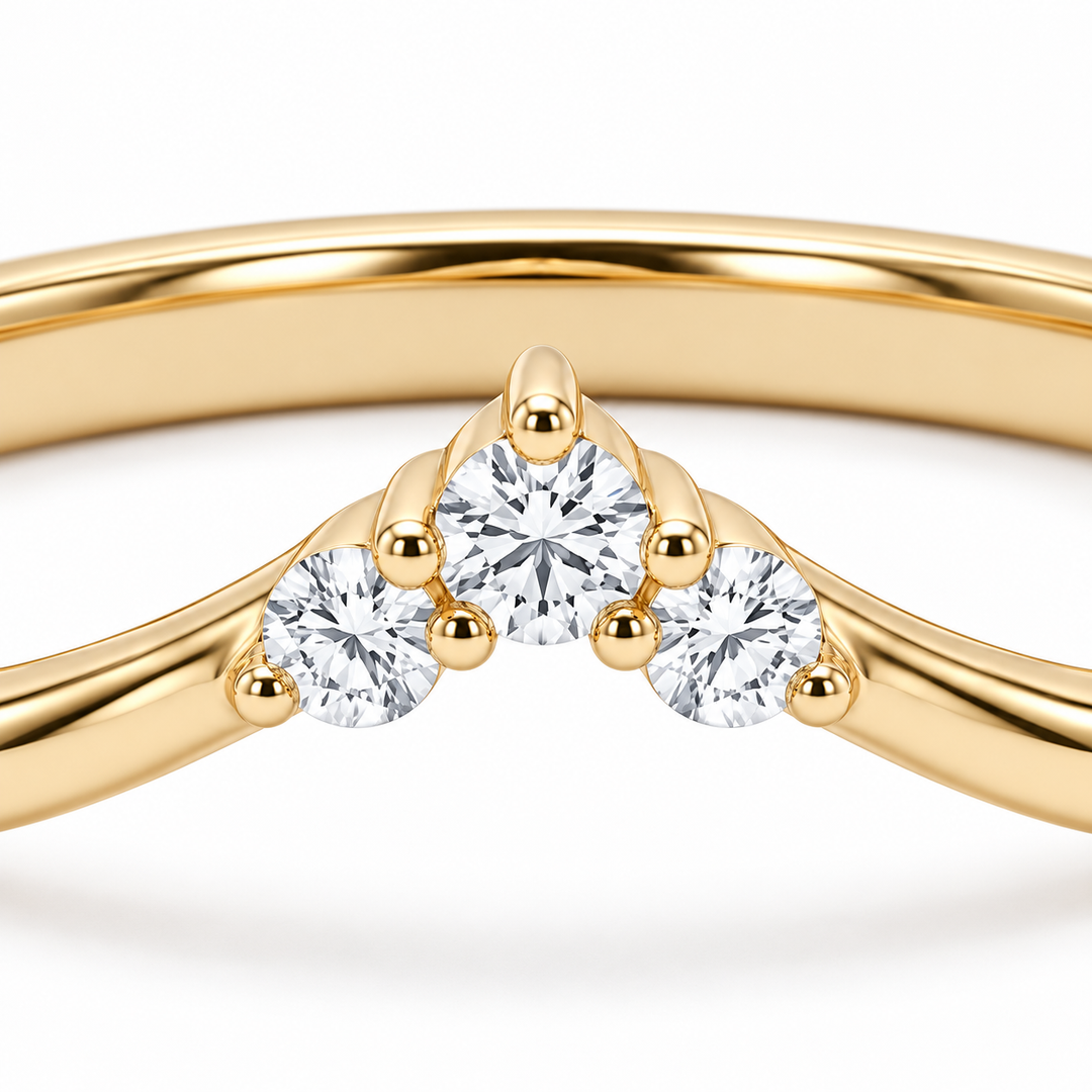The Diadem diamond V contour wedding band in 14K yellow gold, close-up detail