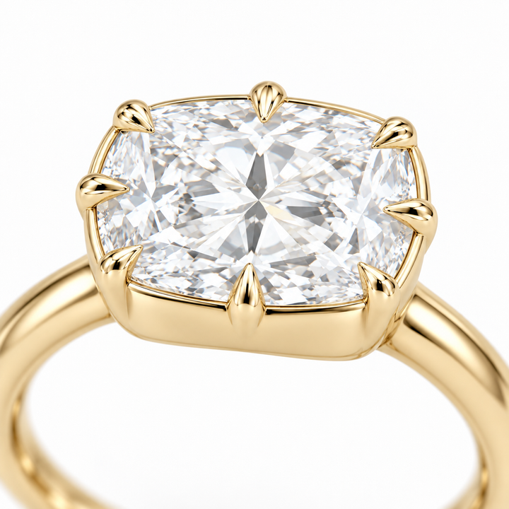 The Camellia east-west cushion lab diamond ring in 14K yellow gold, claw detail