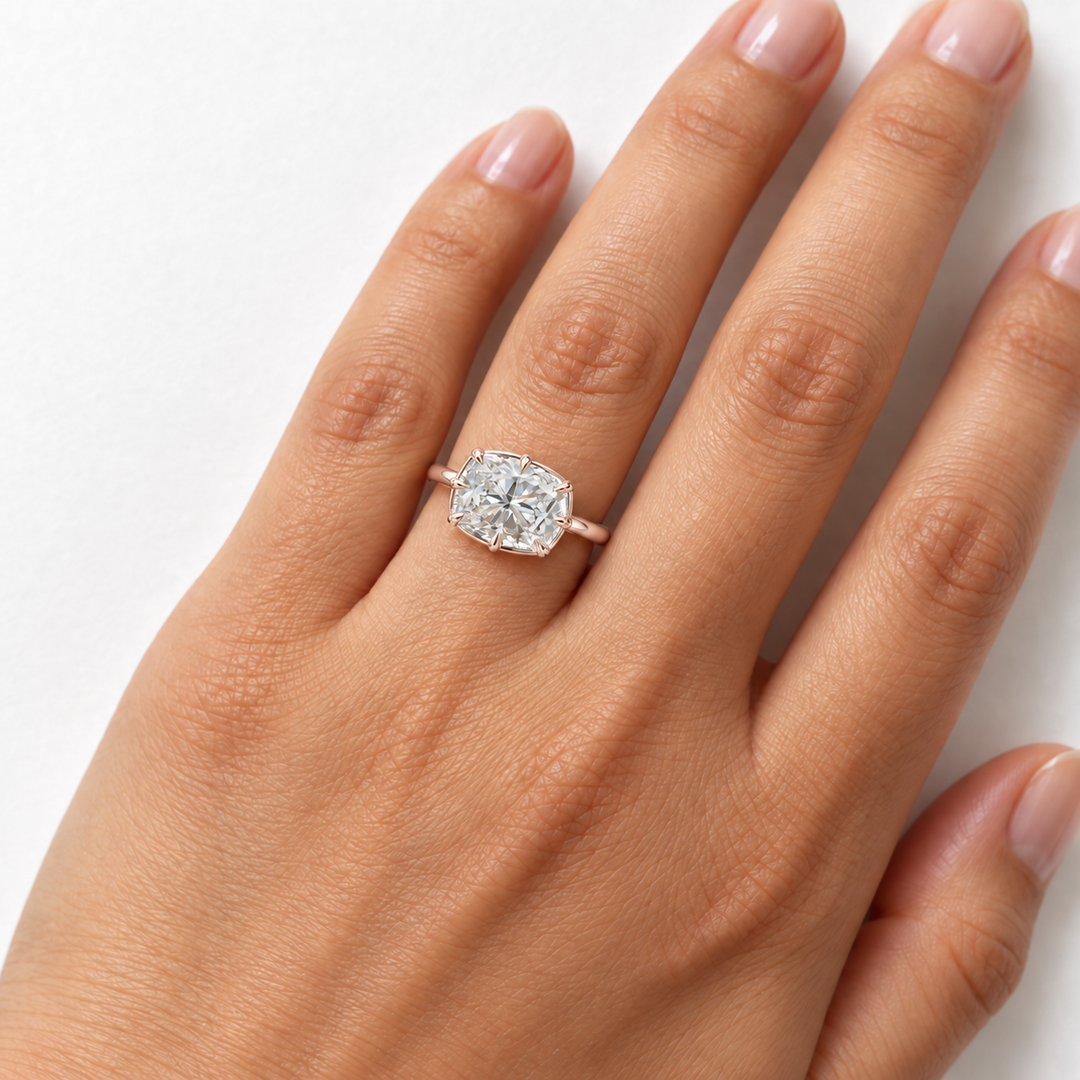 The Camellia east-west cushion lab diamond ring in 14K rose gold, on the hand