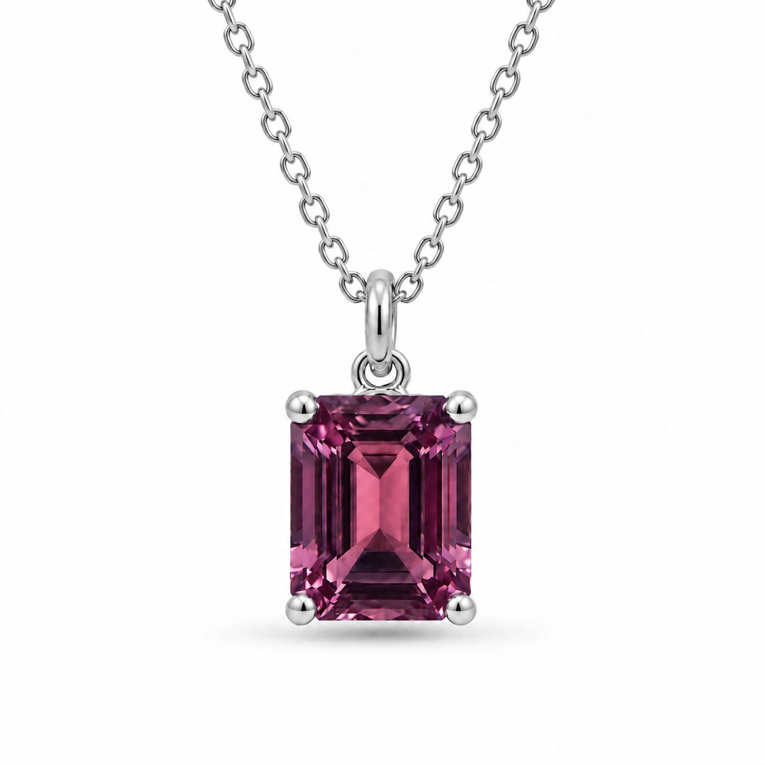Emerald-Cut Lab Alexandrite Pendant in 14K White Gold under warm indoor light, alexandrite color change