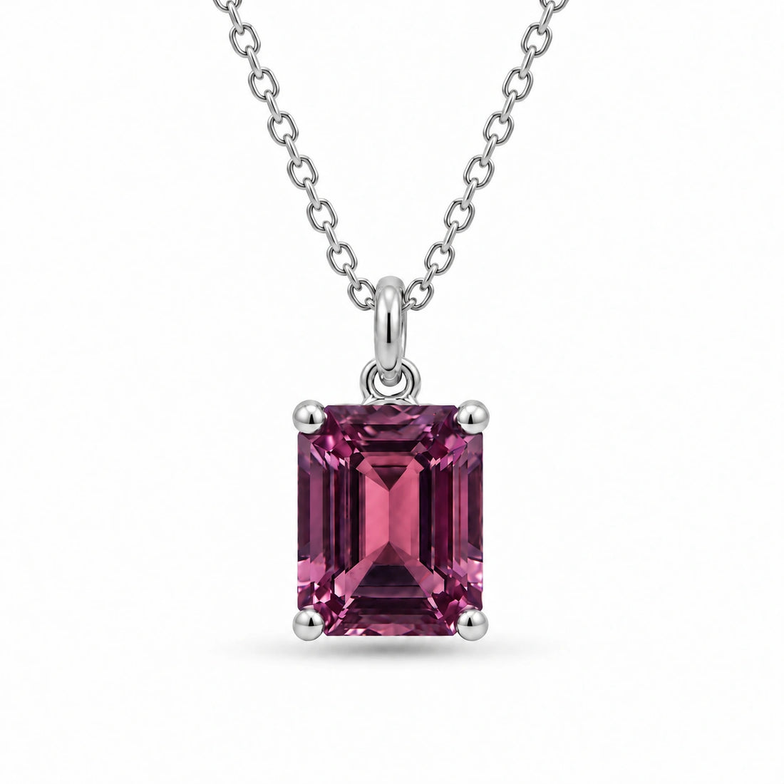 Emerald-Cut Lab Alexandrite Pendant in 14K White Gold under warm indoor light, alexandrite color change