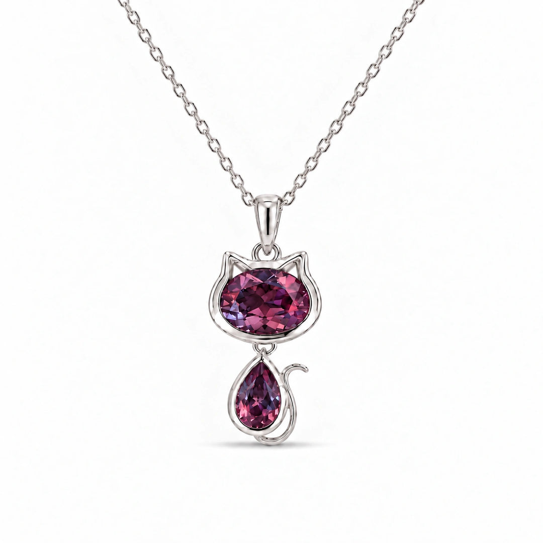 Cat Lab Alexandrite Pendant in Platinum 950 under warm indoor light, alexandrite color change