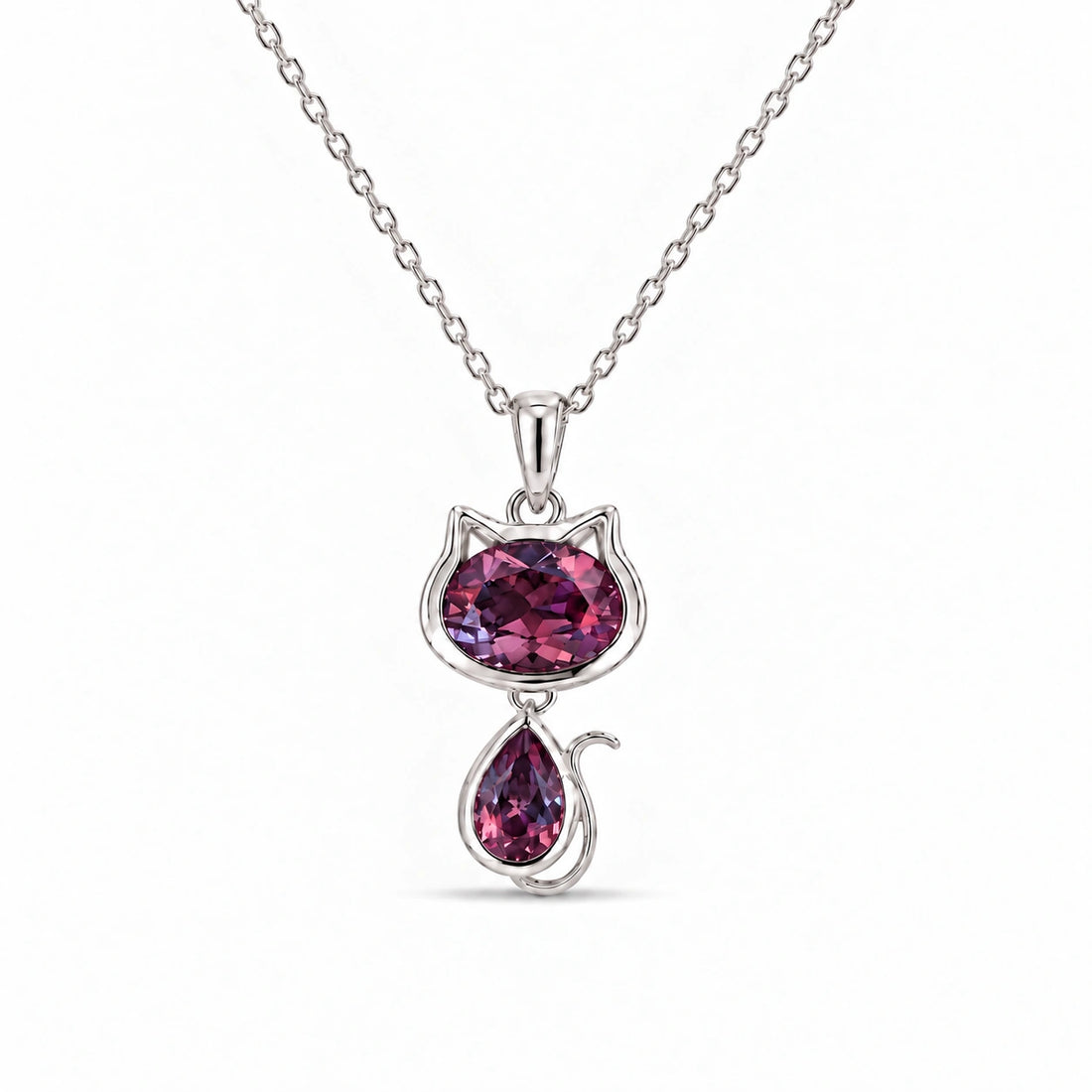 Cat Lab Alexandrite Pendant in Platinum 950 under warm indoor light, alexandrite color change