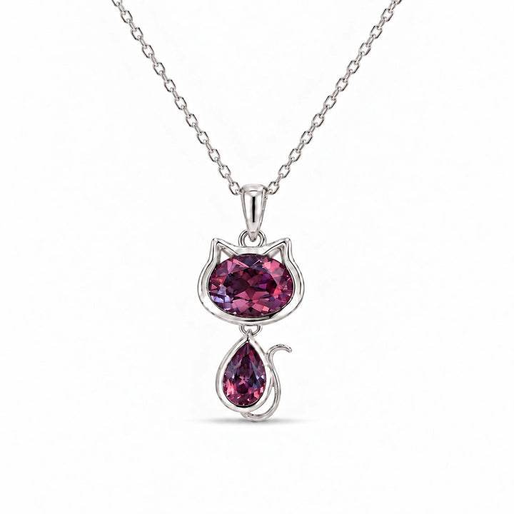 Cat Lab Alexandrite Pendant in Platinum 950 under warm indoor light, alexandrite color change