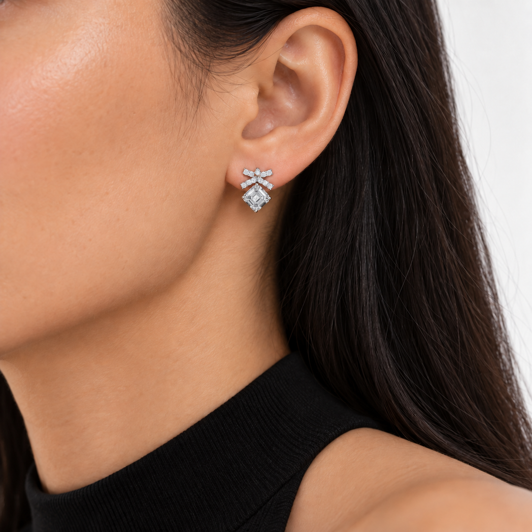 Asscher Bow Lab Diamond Stud Earrings worn on the ear, shown true to size